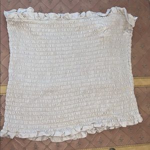 a tan ruffed tube top